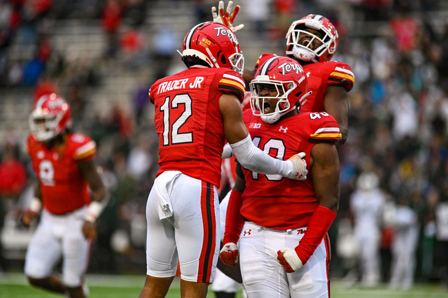 Oct 1, 2022; College Park, Maryland, USA; Maryland Terrapins defensive lineman Taizse Johnson (40) celebrates with defensive back Dante Trader Jr. (12) during the second half against the Michigan State Spartans at Capital One Field at Maryland Stadium. Mandatory Credit: Tommy Gilligan-USA TODAY Sports